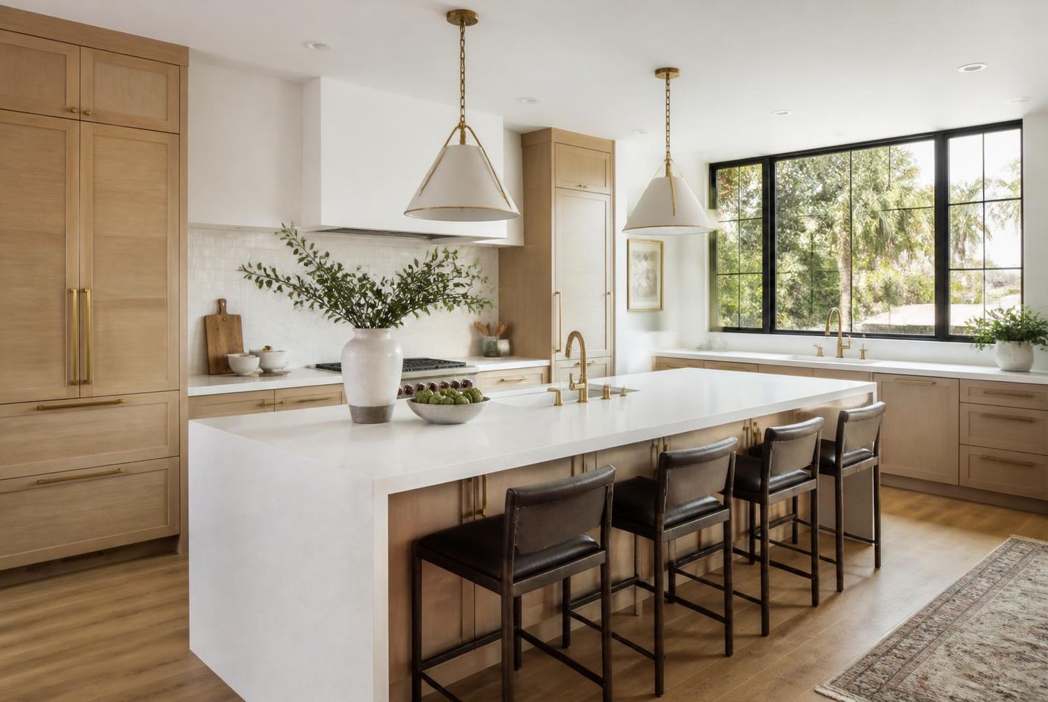 White oak kitchen remodel with quartz waterfall island
